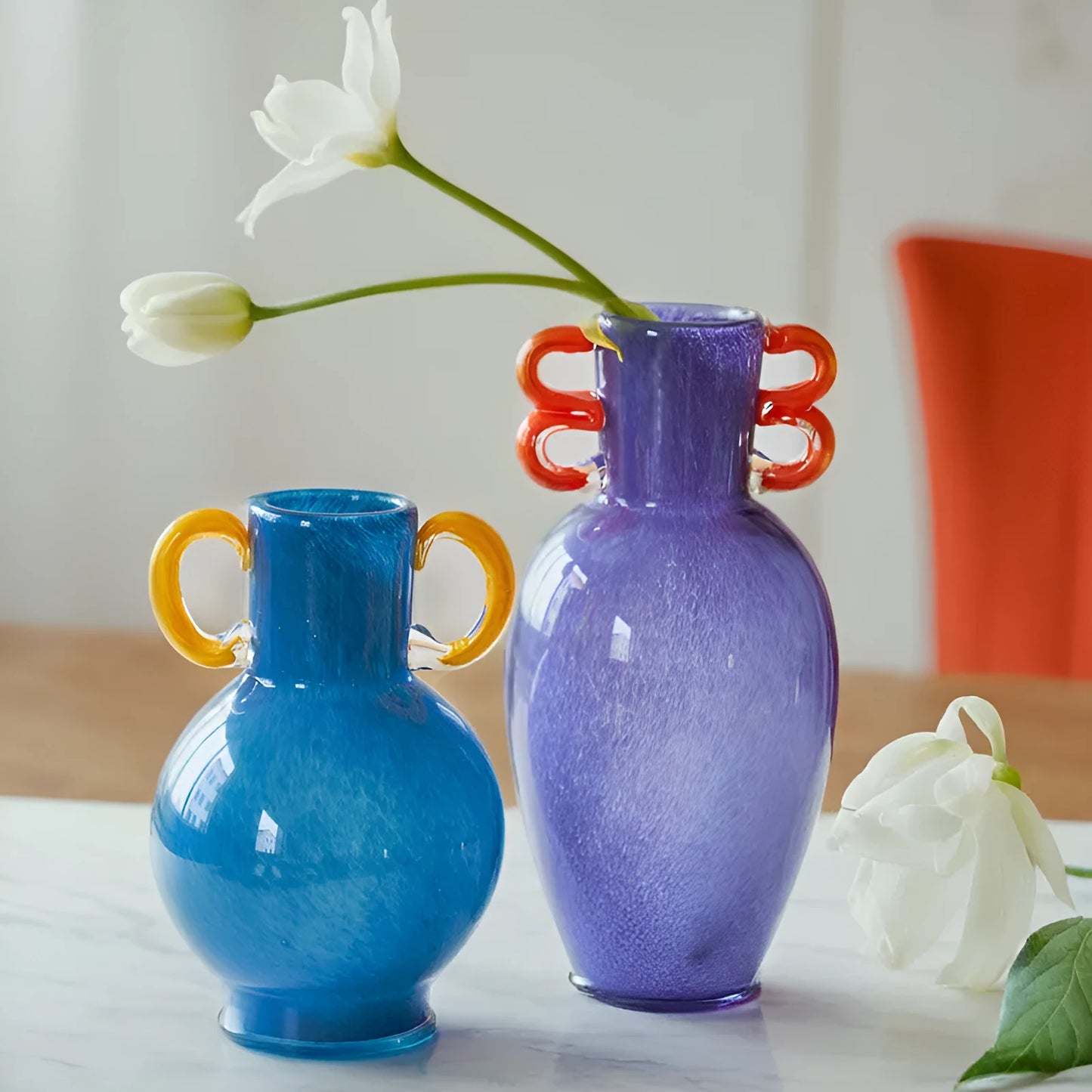 Handmade straight glass vase with a gradient colour effect and polished surface in a Nordic modern style.