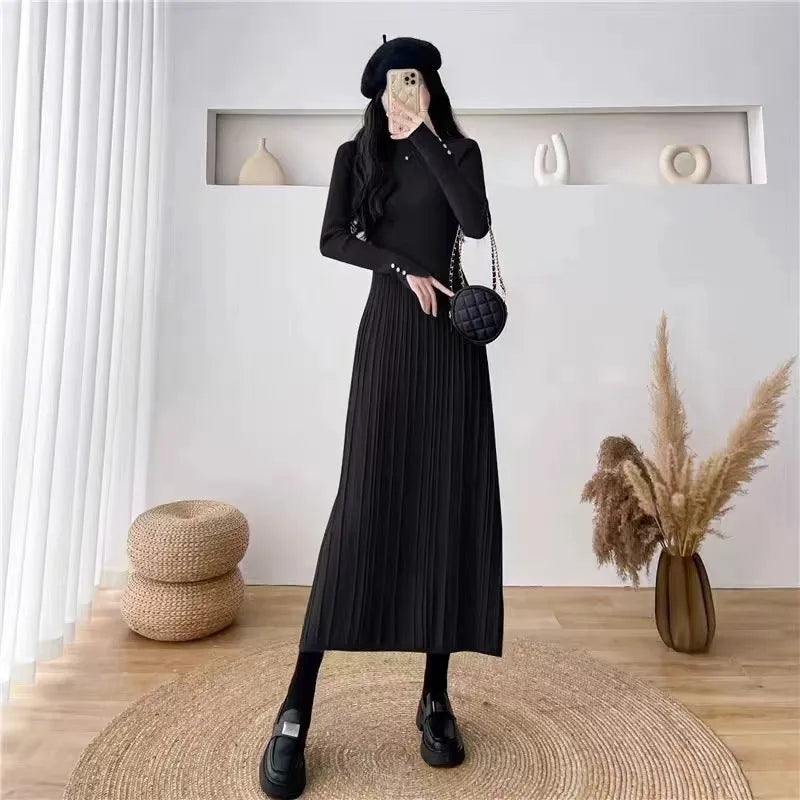 Women's beige high-waisted A-line pullover dress with a knitted texture, midi length.