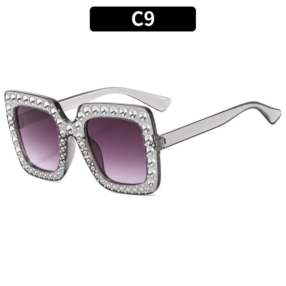 Plastic sunglasses with fashion personality styling in various colour options including black frame and transparent tea frame