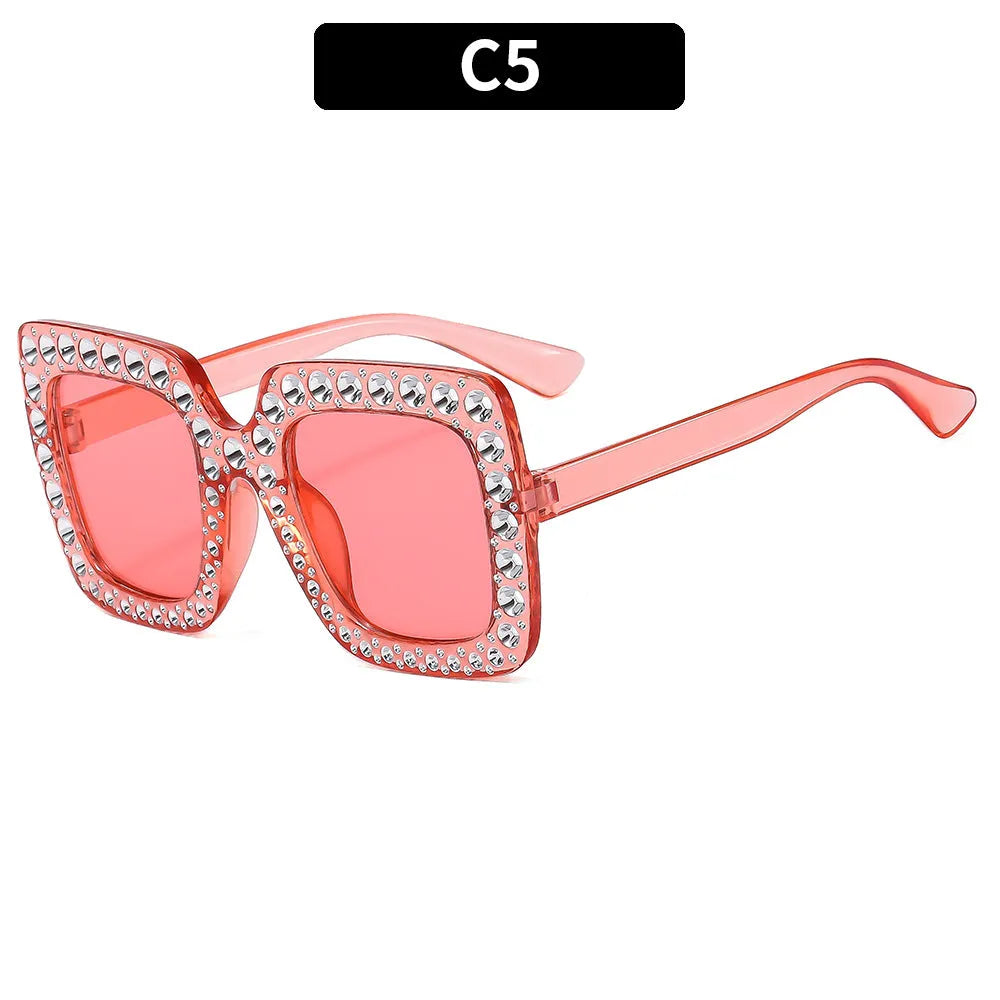 Plastic sunglasses with fashion personality styling in various colour options including black frame and transparent tea frame
