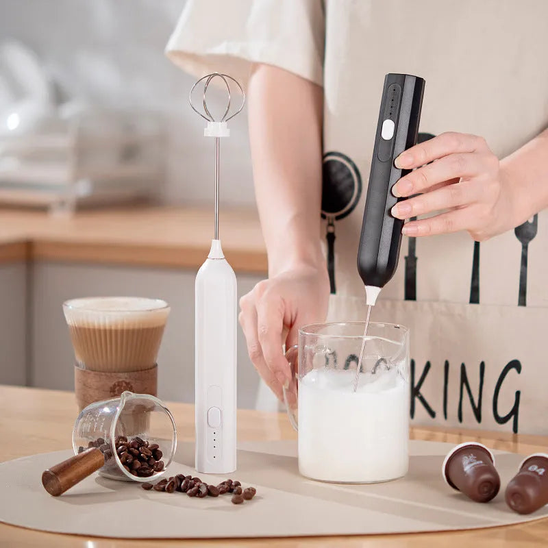 Handheld USB rechargeable electric whisk in apricot colour with mixing attachment