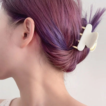 Acetate hair barrettes with metal alloy grip in leopard print, white, and ink colour options