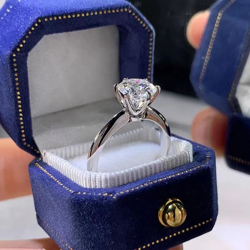 White gold plated zircon ring with six-claw setting and geometric shape on white copper base