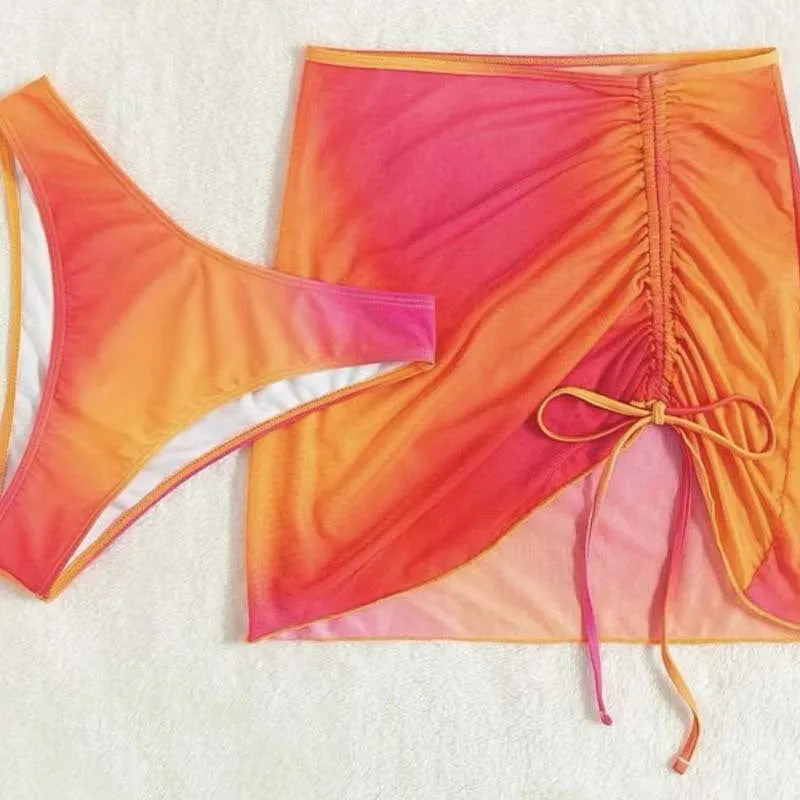 Women's three-piece swimsuit with loop buckle hollow suspender design in gradient print, available in orange and purple colour options for swimming, wading, and water sports.