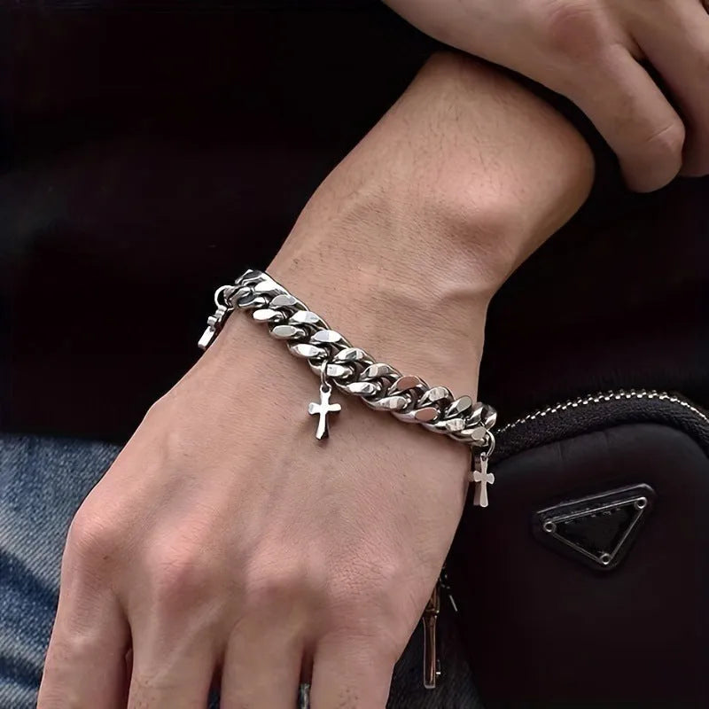 Men's titanium steel bracelet with a geometric cross design on a wrist.