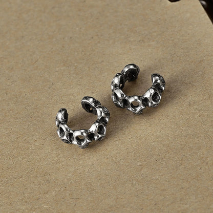 Stainless steel skull ear clip earrings with hollow geometric design and electroplated finish