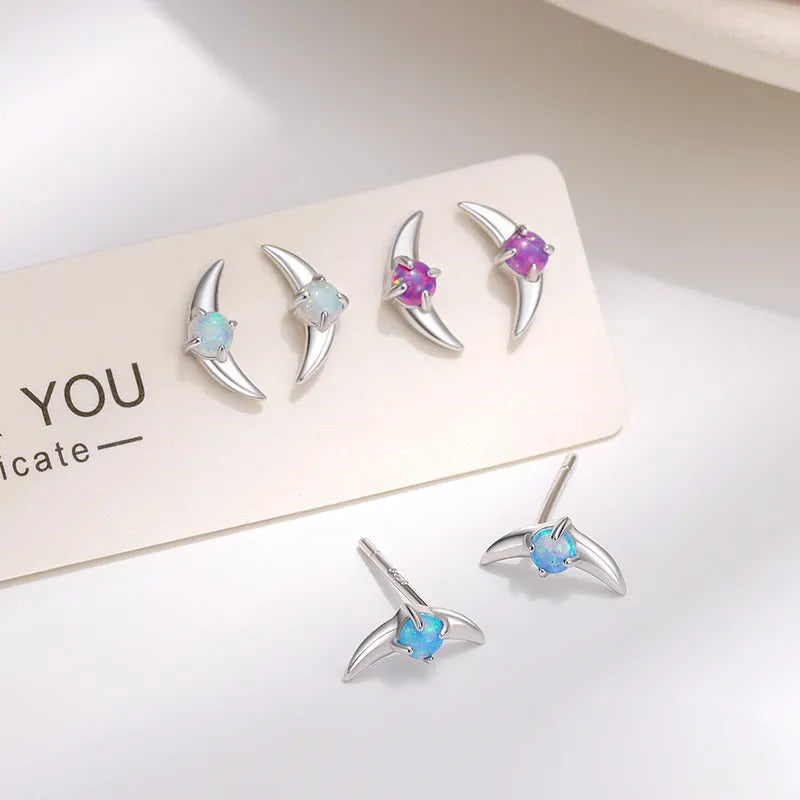 Women's earrings crafted from 925 sterling silver with electroplated gold or platinum colour finishes and faceted crystal stones in geometric shapes, available in blue, purple or white stone variants for simple lightweight luxury jewellery.