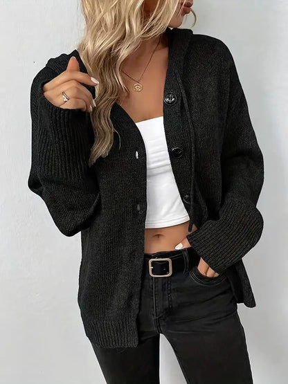 Loose fit grey hooded cardigan sweater with long sleeves on a hanger.