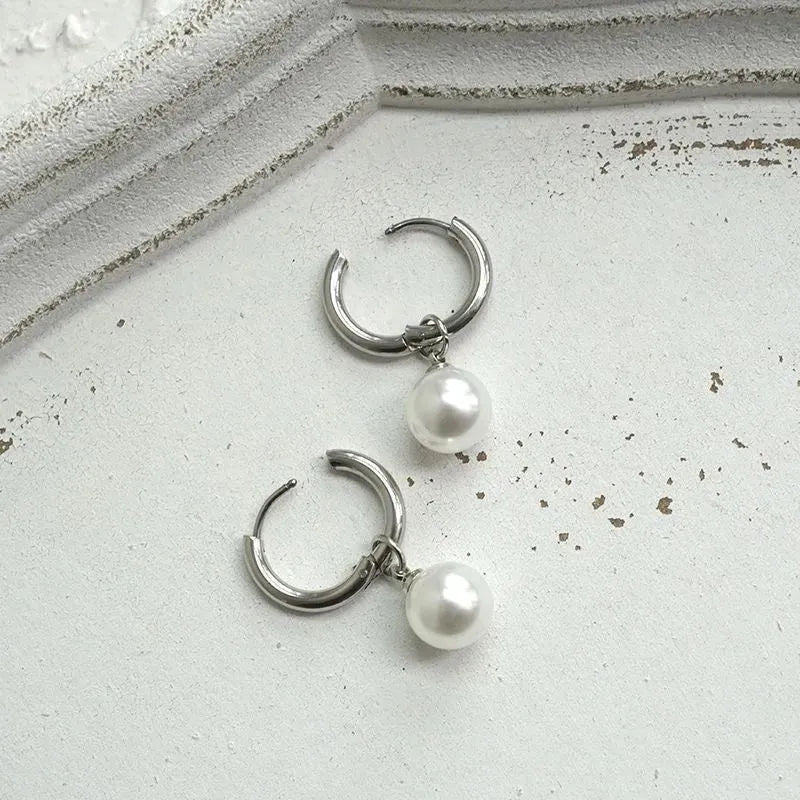 Women's geometric pearl drop earrings with titanium steel posts and round design elements