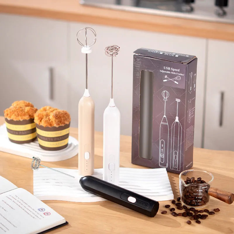 Handheld USB rechargeable electric whisk in apricot colour with mixing attachment