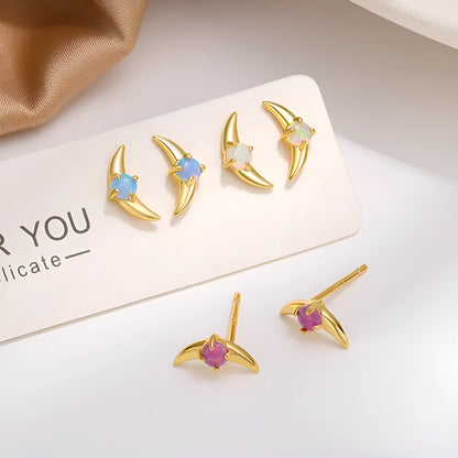Women's geometric sterling silver earrings with electroplated gold finish and blue crystal stones