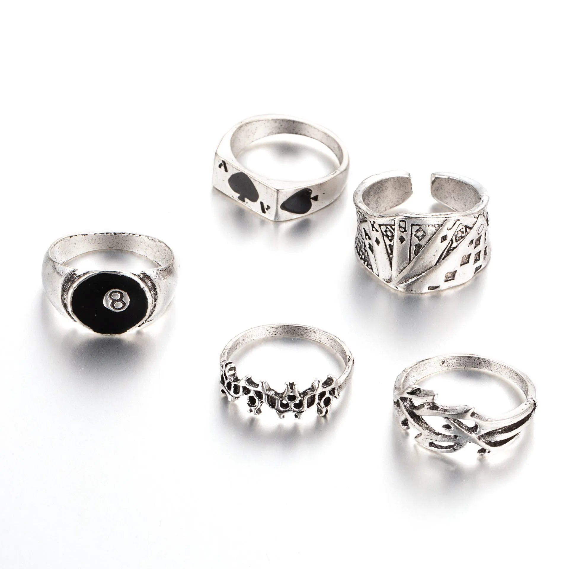 Black adjustable ring with a raised polished spade card suit motif on a wide band.