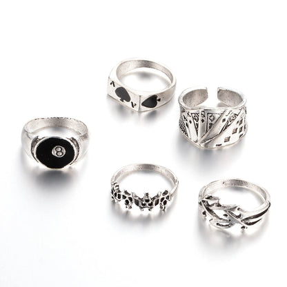 Black adjustable ring with a raised polished spade card suit motif on a wide band.