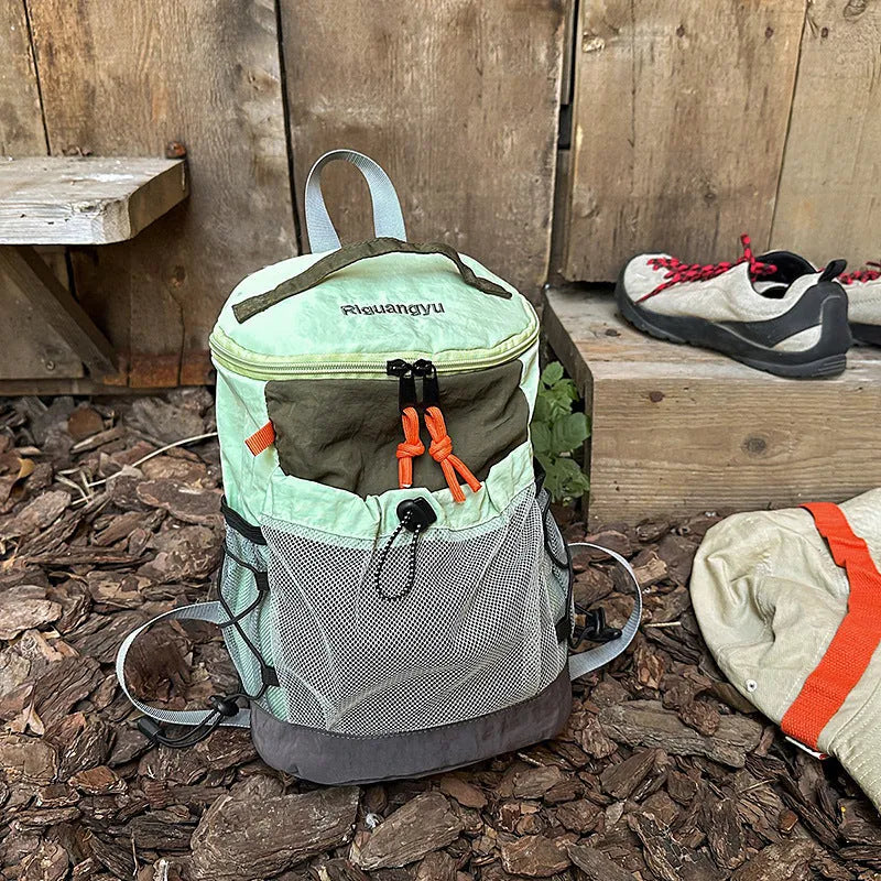 Waterproof nylon casual backpack in blue with curved shoulder straps and fold details