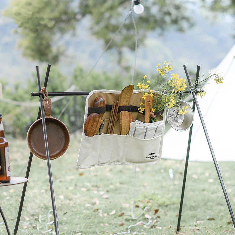 Durable, organised portable picnic tableware storage bag with multiple compartments for utensils