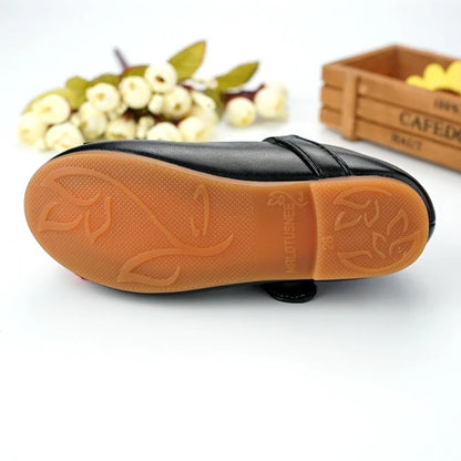 A pair of children's shoes in a unique and stylish Korean-inspired design, featuring a microfiber leather upper and a comfortable, durable beef tendon sole.