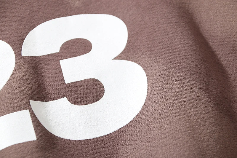 High Street men's and women's casual loose sweater in coffee colour, featuring a soft, velvet-like texture and a contemporary loose fit