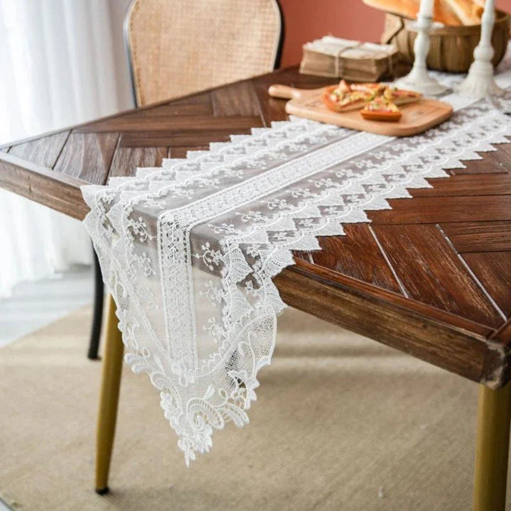 Elegant lace table runner with intricate embroidered patterns and hollowed-out design