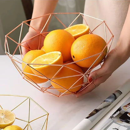 Wrought iron storage basket in black, gold, and rose gold colors, featuring a round, industrial-inspired design for versatile home organisation.