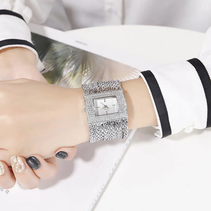 Ladies Gold Quartz Square Chain Rhinestone Watch with a sparkling rhinestone-encrusted face and a durable alloy chain
