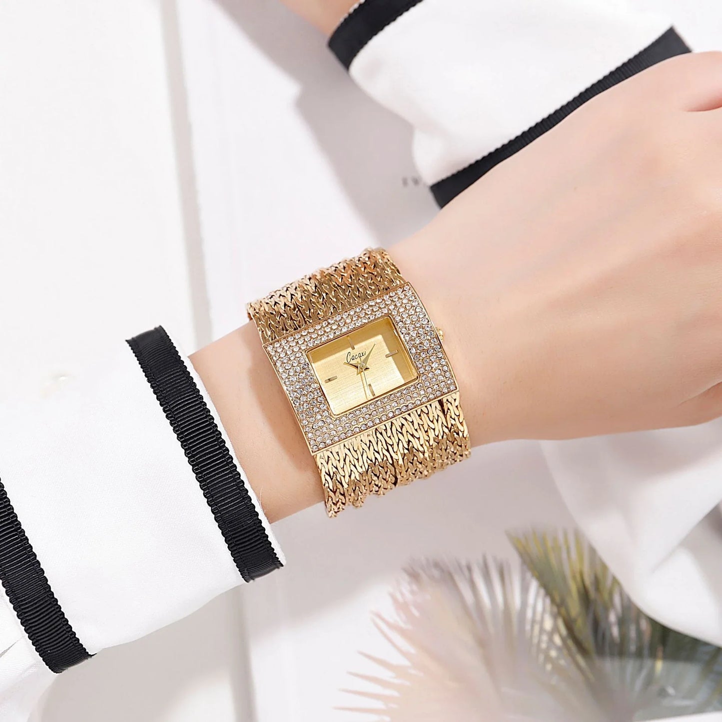 Ladies Gold Quartz Square Chain Rhinestone Watch with a sparkling rhinestone-encrusted face and a durable alloy chain