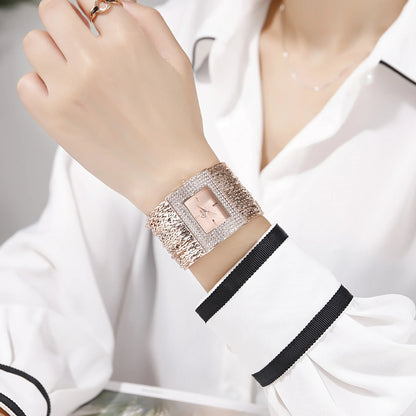 Ladies Gold Quartz Square Chain Rhinestone Watch with a sparkling rhinestone-encrusted face and a durable alloy chain