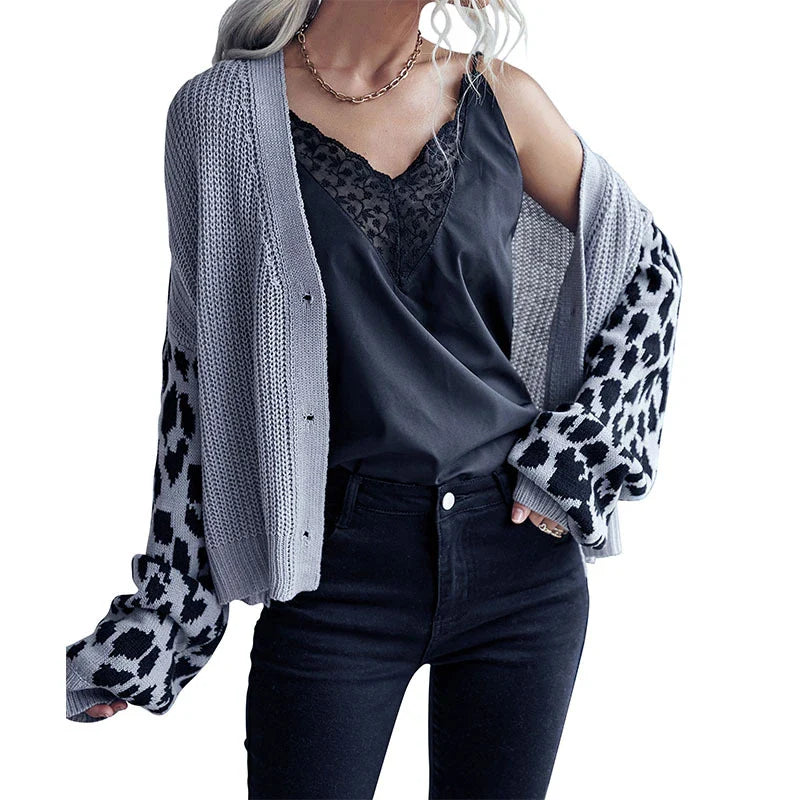 A stylish leopard print sweater coat with long sleeves and a classic design, perfect for autumn and winter in the UK.