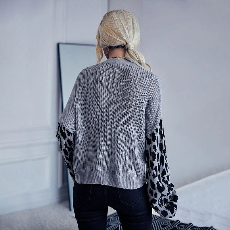 A stylish leopard print sweater coat with long sleeves and a classic design, perfect for autumn and winter in the UK.