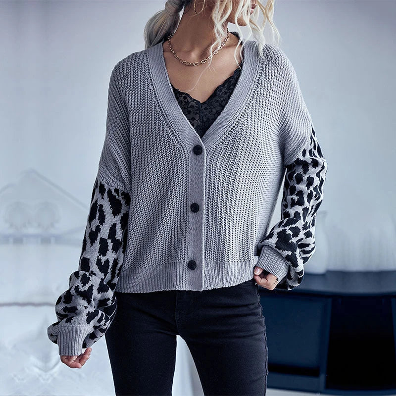 A stylish leopard print sweater coat with long sleeves and a classic design, perfect for autumn and winter in the UK.