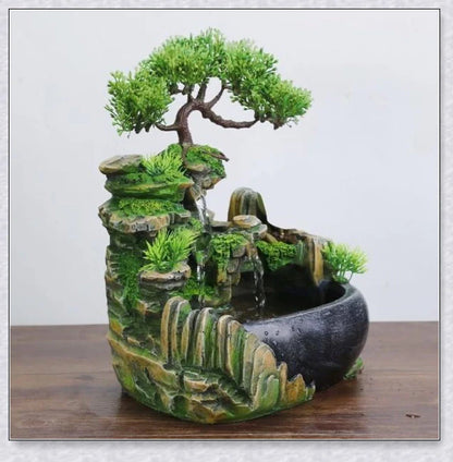 A beautiful resin tabletop fountain with flowing water, mimicking a river down a mountainside.