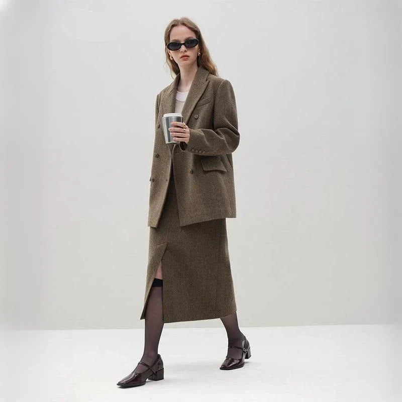 Elegant wool blazer skirt set for professional and formal wear, featuring a double-breasted jacket and a front-split long skirt in a sophisticated solid pattern.