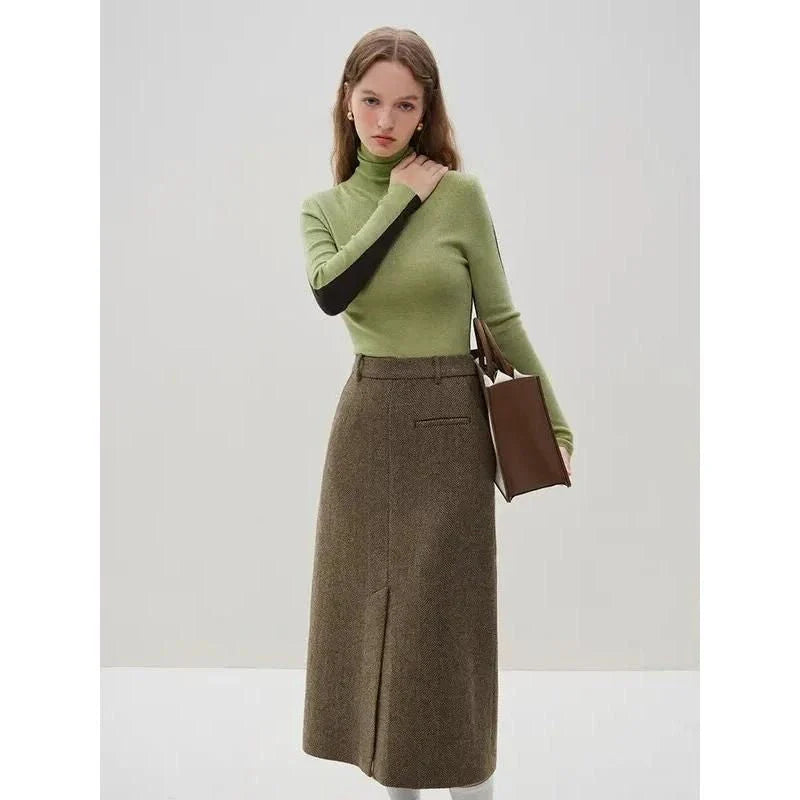 Elegant wool blazer skirt set for professional and formal wear, featuring a double-breasted jacket and a front-split long skirt in a sophisticated solid pattern.