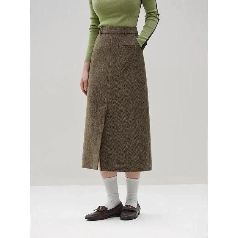 Elegant wool blazer skirt set for professional and formal wear, featuring a double-breasted jacket and a front-split long skirt in a sophisticated solid pattern.