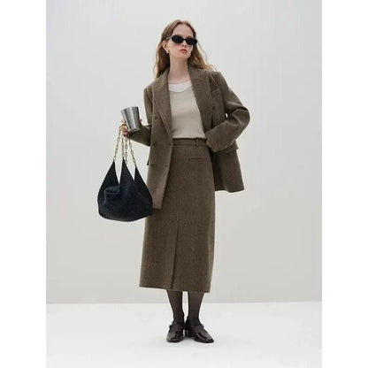 Elegant wool blazer skirt set for professional and formal wear, featuring a double-breasted jacket and a front-split long skirt in a sophisticated solid pattern.