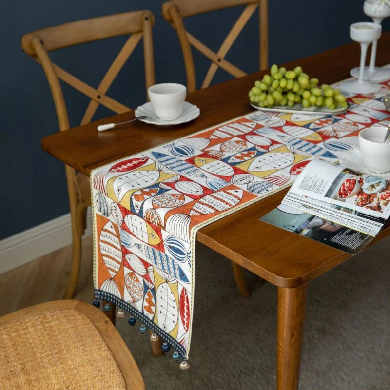 A festive jacquard table runner featuring a vibrant fish design, perfect for adding a touch of charm to your dining and home decor.