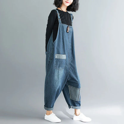 Casual literary women's plus size denim overalls with a high-waisted design and distressed accents for a stylish, comfortable look.