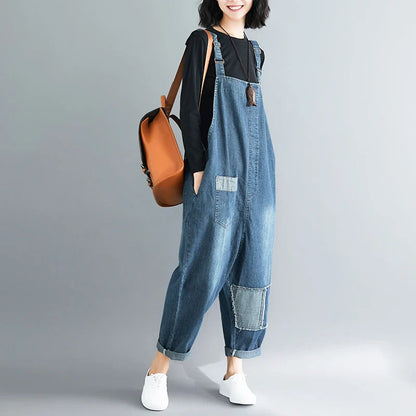 Casual literary women's plus size denim overalls with a high-waisted design and distressed accents for a stylish, comfortable look.
