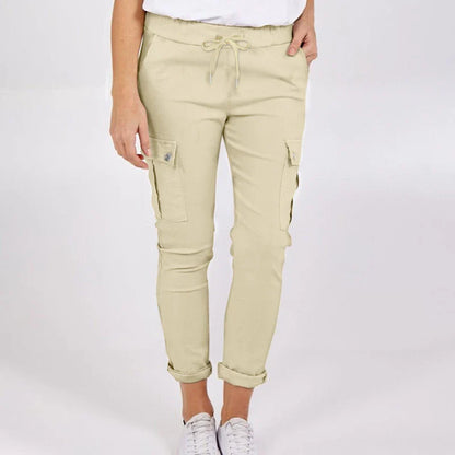 Women wearing casual cargo trousers with pockets in a solid colour and drawstring waist