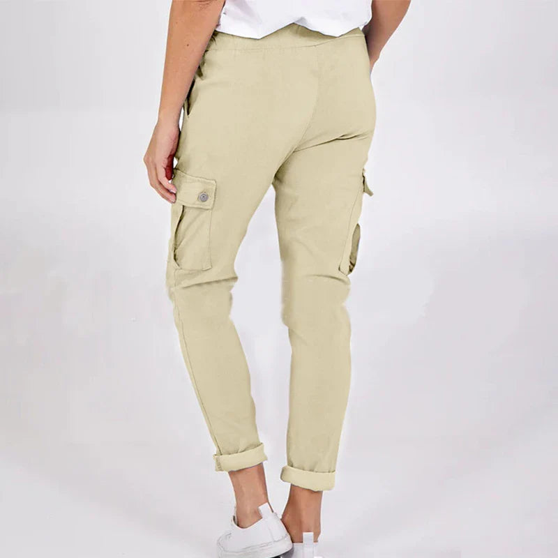 Women wearing casual cargo trousers with pockets in a solid colour and drawstring waist