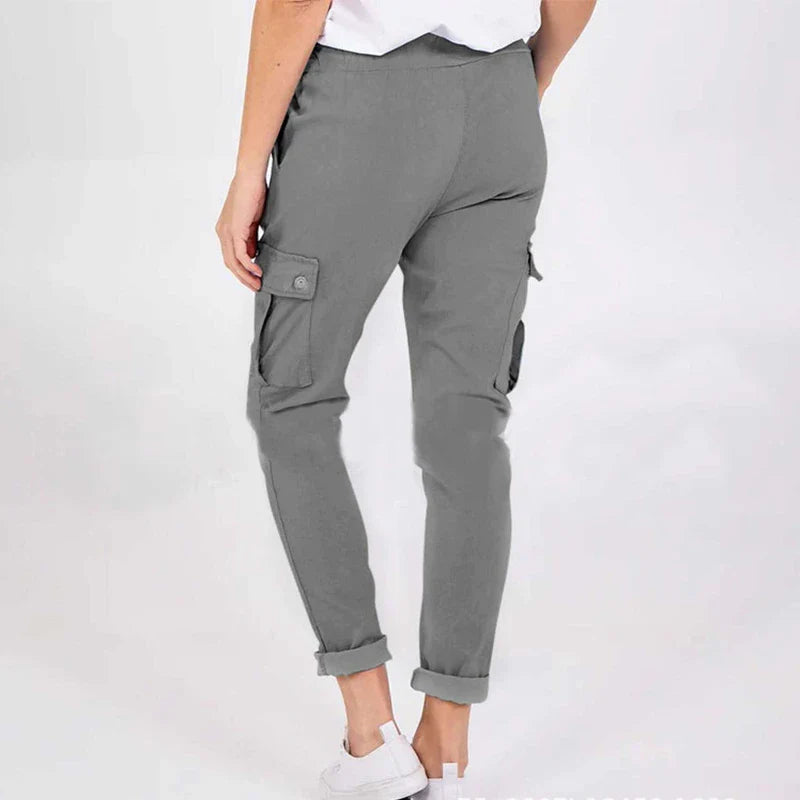 Women wearing casual cargo trousers with pockets in a solid colour and drawstring waist
