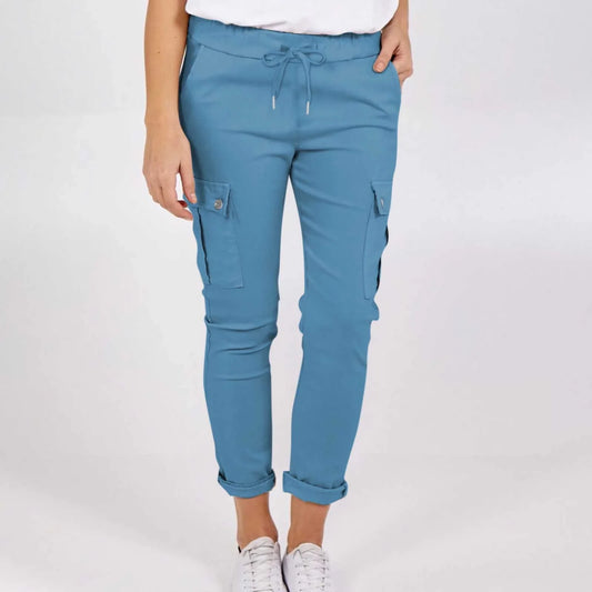 Women wearing casual cargo trousers with pockets in a solid colour and drawstring waist