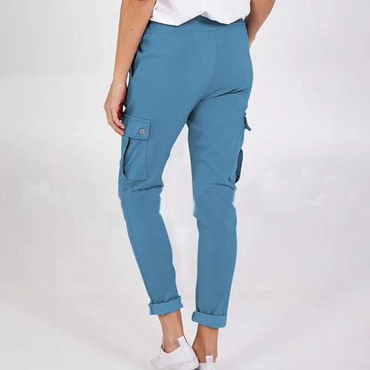 Women wearing casual cargo trousers with pockets in a solid colour and drawstring waist