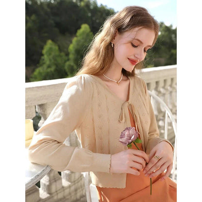 Apricot Elegant V-Neck French Style Knit Cardigan with delicate bow detail and jacquard pattern