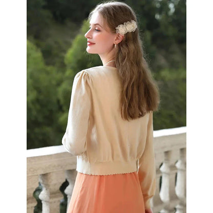Apricot Elegant V-Neck French Style Knit Cardigan with delicate bow detail and jacquard pattern