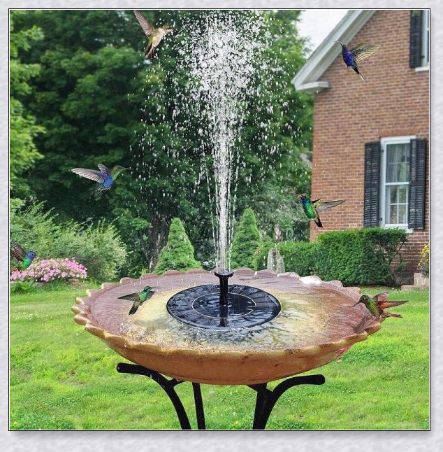 Solar-powered bird bath water fountain pump in a garden or pond setting, creating a relaxing display of water