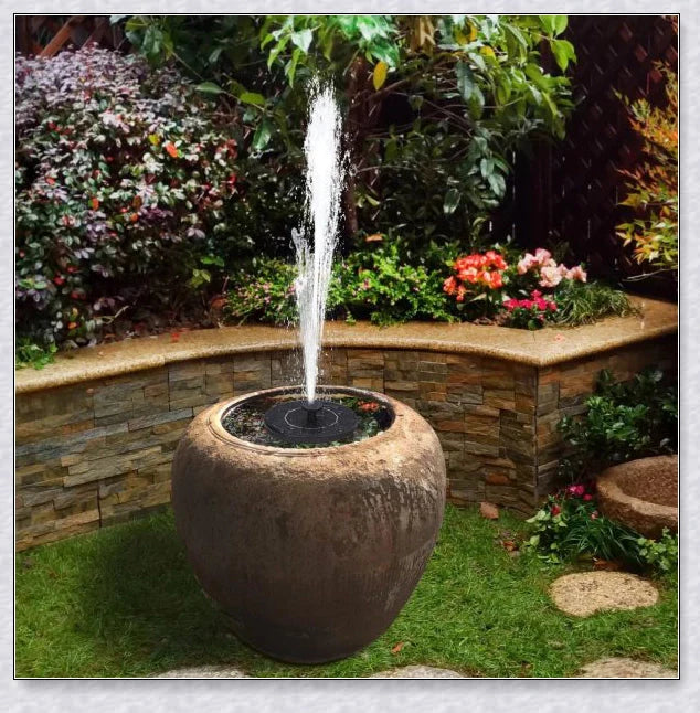 Solar-powered bird bath water fountain pump in a garden or pond setting, creating a relaxing display of water