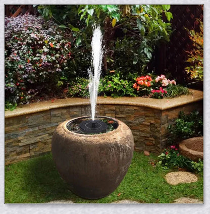 Solar-powered bird bath water fountain pump in a garden or pond setting, creating a relaxing display of water