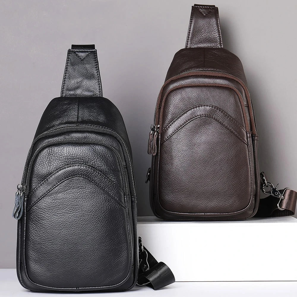 Premium genuine leather crossbody bag in black with multiple internal compartments and adjustable strap for versatile everyday wear