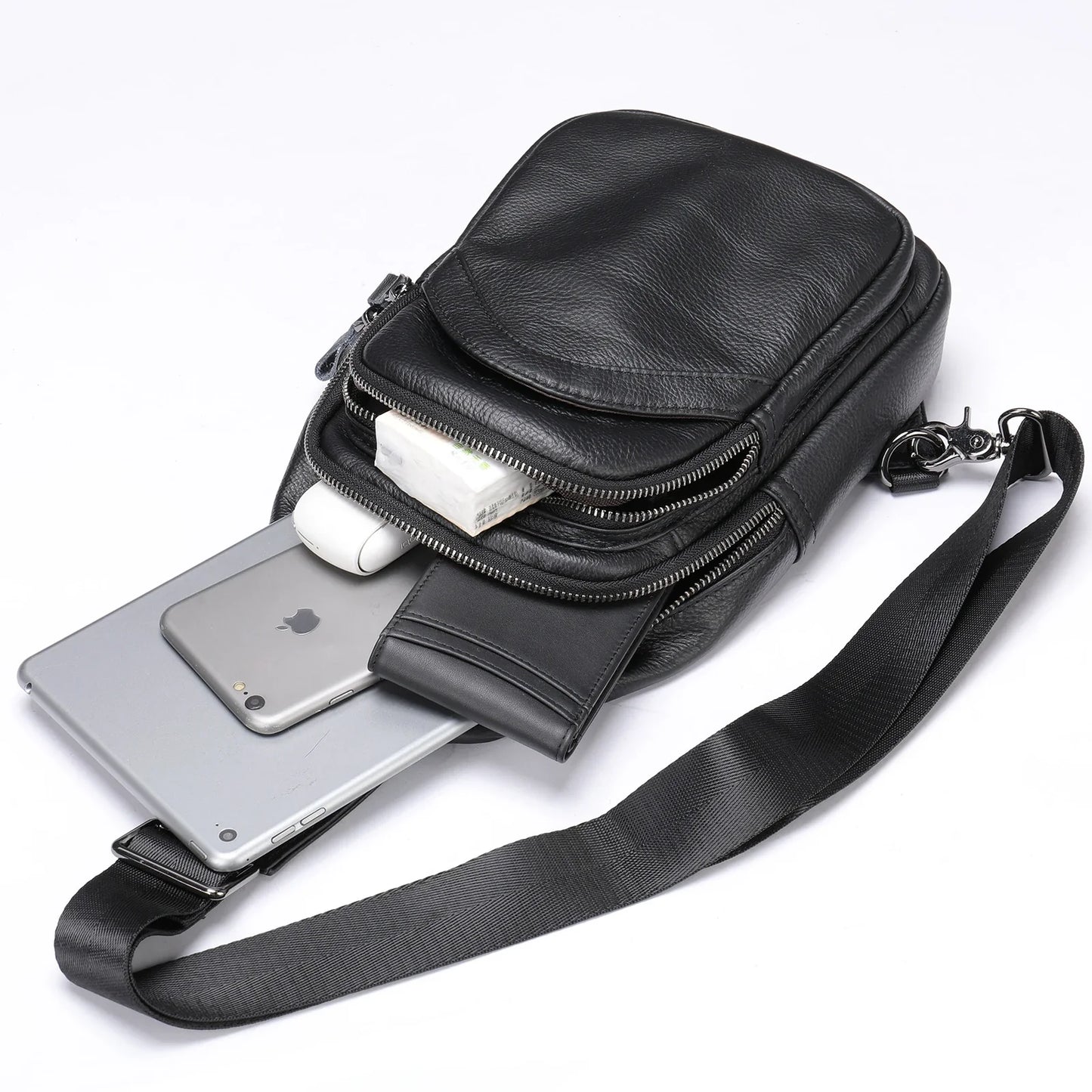 Premium genuine leather crossbody bag in black with multiple internal compartments and adjustable strap for versatile everyday wear