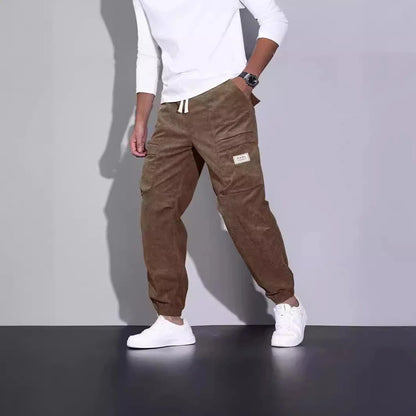 Men's corduroy overalls with ankle-tied loose fit and multi-pocket design, available in a range of autumnal colours